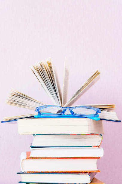 istock Many old books on bookshelf on simple backdrop. Copy space for your text. 1224574950
