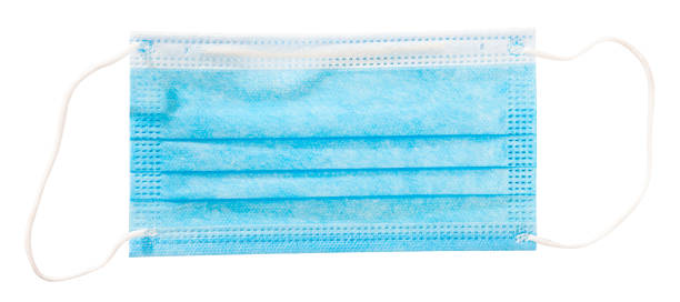 istock Blue medical face mask on table 1224576354