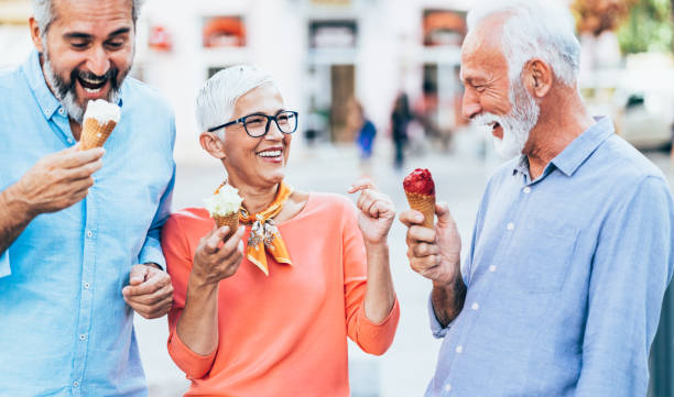 istock Happy senior friends eating ice cream 1224578640