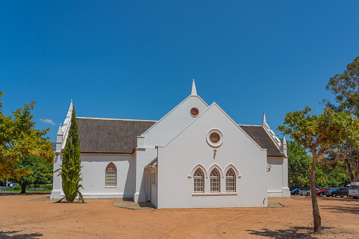 White Dutch Reformed Church in Franschhoek, South Africa with blue sky