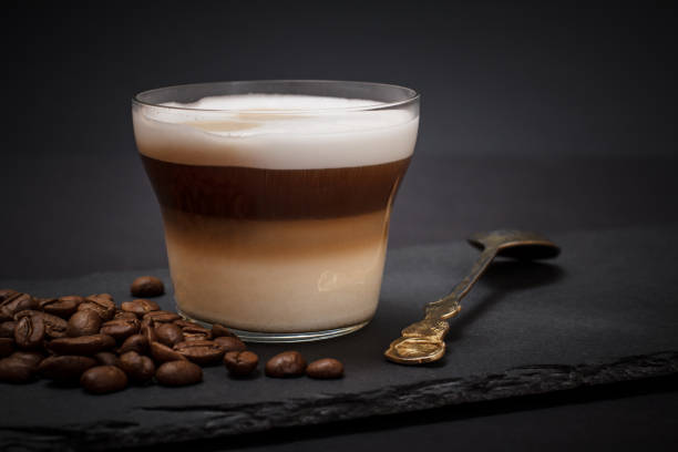 istock Coffee cappuccino and coffee beans on black background 1224580768