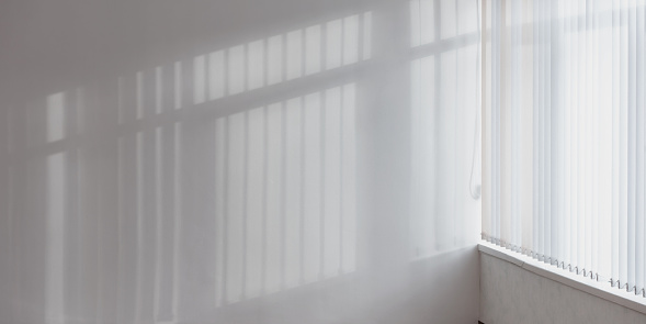 light through large window illuminate white wall in empty room mockup