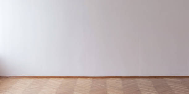 istock light through window illuminates large hall with empty concrete wall mock up 1224584015