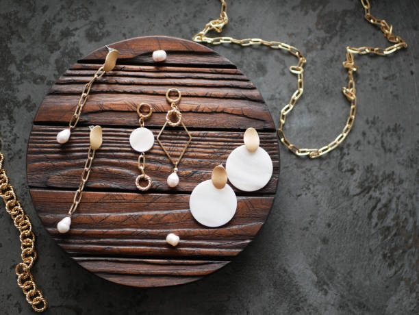 istock Gold jewelry on a tree. flat lay 1224585394
