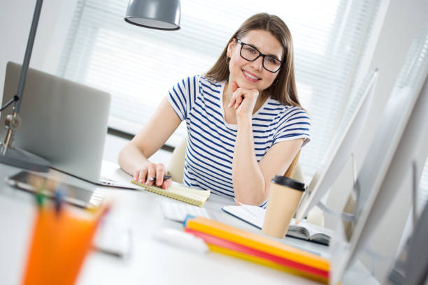 istock Portrait of a happy female student in a computer class 1224586119