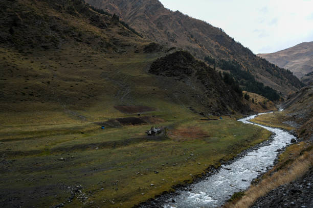 istock River crossing a mountain valley on the way between Parsma and Dartlo. 1224586123