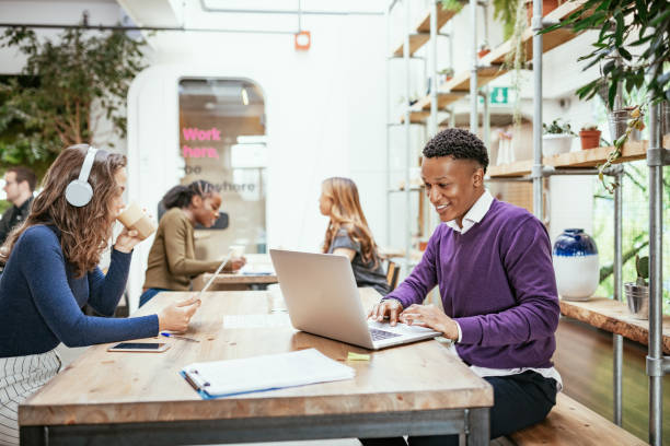 Diverse business people telecommuting from cafe