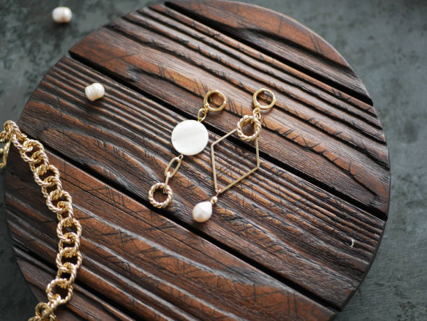 istock Gold jewelry on a tree. flat lay 1224586978