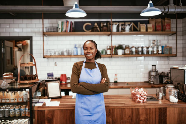 istock Barista in modern bar serving customers 1224587070