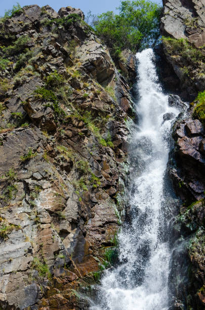 istock fast waterfall among a rocky gorge in the mountains 1224588092