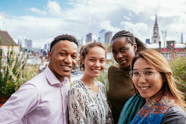 istock Group of diverse millennials looking at camera and smiling 1224588280