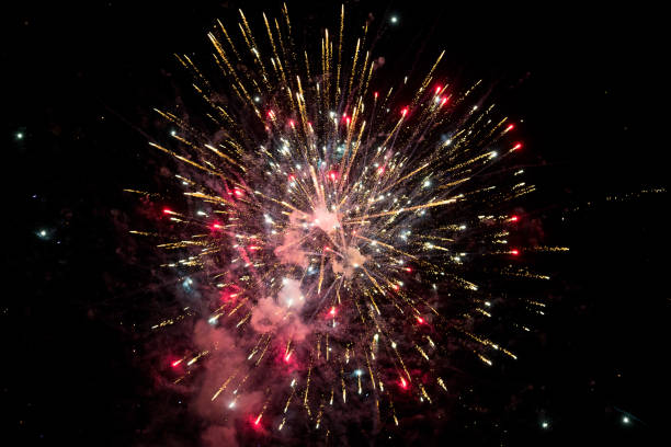 istock Low Angle View Of Firework Display Against Sky At Night 1224591256
