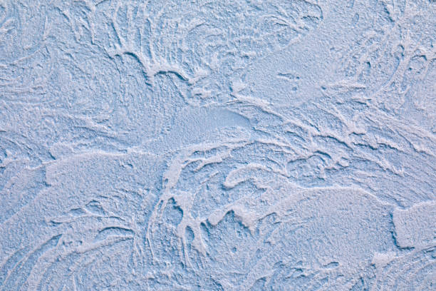 istock The relief blue wall is finished with decorative plaster. Abstract streaks like waves on a concrete wall. Design background on the theme of renovation of old housing, commercial real estate. 1224596149