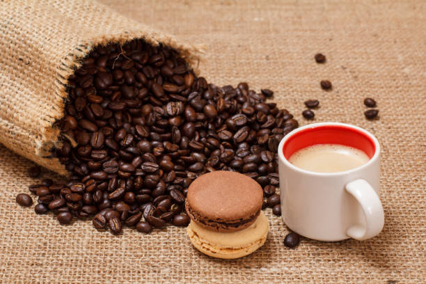 istock Cup of coffee and roasted coffee beans in a canvas sack. 1224596314