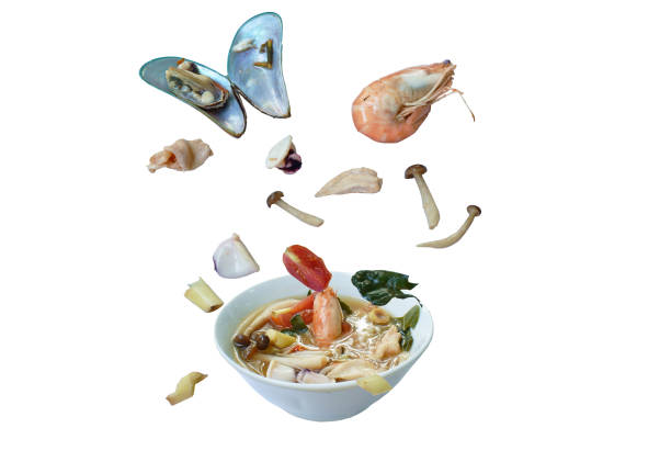 boiled shrimp and chicken with mussel in thai spicy tom yum soup floating on bowl - 13520 imagens e fotografias de stock