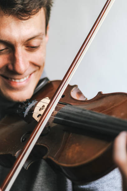 istock Young man playing a violin close up 1224603643