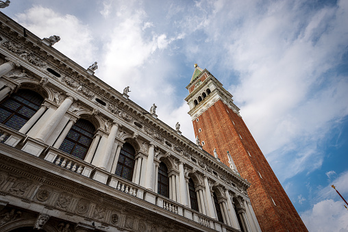 Venice Italy, Piazza San Marco (St Mark square) with the bell tower (Campanile) and the palace of the Biblioteca Nazionale Marciana (National Library). UNESCO world heritage site, Veneto, Italy, Europe