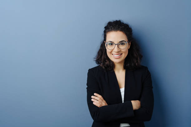 istock Young woman with folded arms and cheerful smile 1224606346