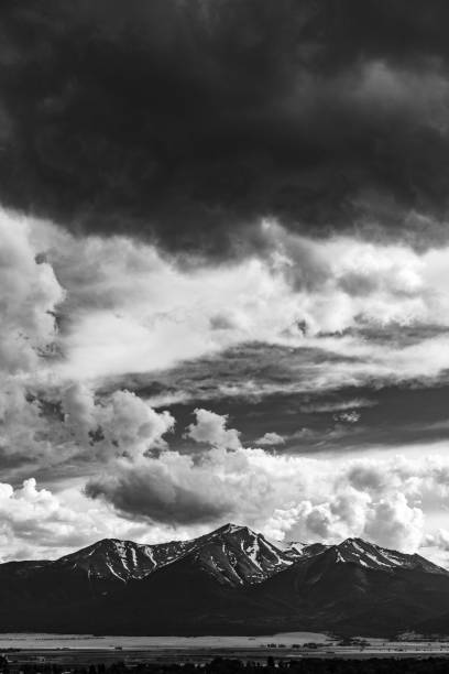 istock Summer storm clouds building over a mountain peak 1224606496