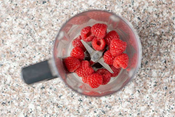 istock Raspberries in smoothie blender. Top view. Creative photo 1224608209