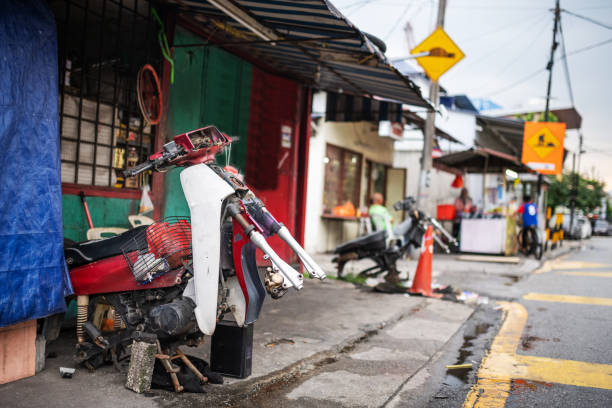 Kuala Lumpur, Malaysia: A motorcycle workshop in Kampung Baru, a poor region of Kuala Lumpur.