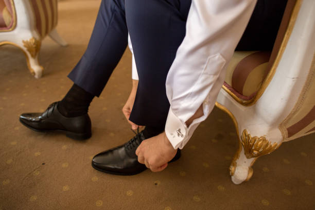 istock man try to put his shoes 1224612792