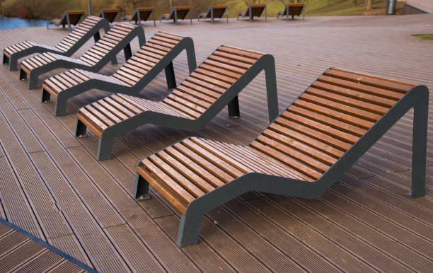 istock Sun loungers  on platform on lake 1224614066