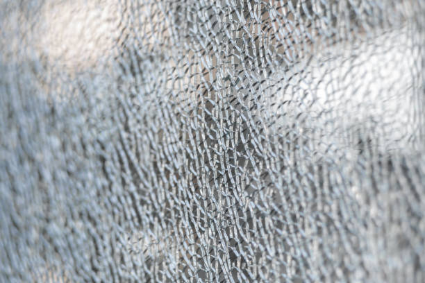 istock Broken tempered glass. Cracked glass web close up 1224614195