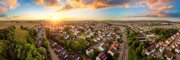 aerial panorama of small town at sunrise - panoramic scenics landscape horizon imagens e fotografias de stock