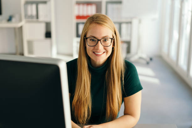 istock Happy young office worker with a friendly smile 1224622460
