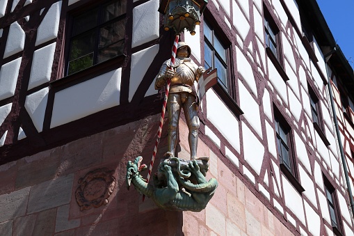 Nuremberg, Germany. 500 year old medieval statue of Saint George the knight, slaying a dragon.