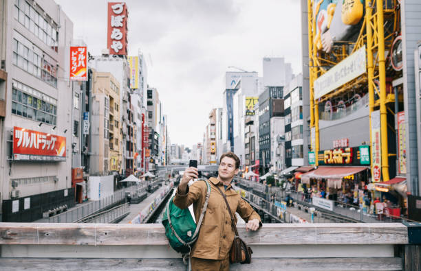 istock Man taking selfie pictures in Dotonbori, Osaka 1224624934