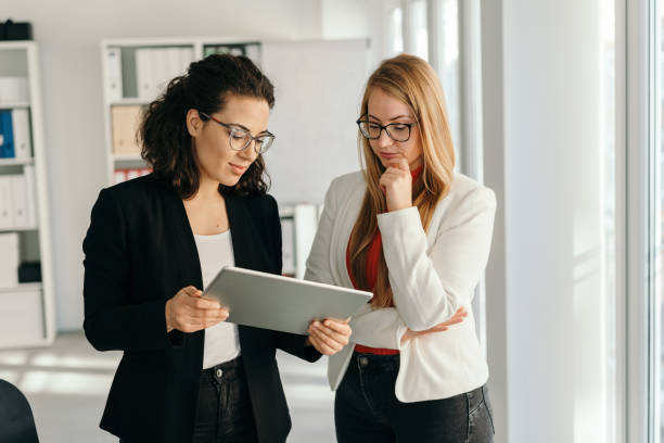 istock Two thoughtful stylish young businesswoman 1224626056
