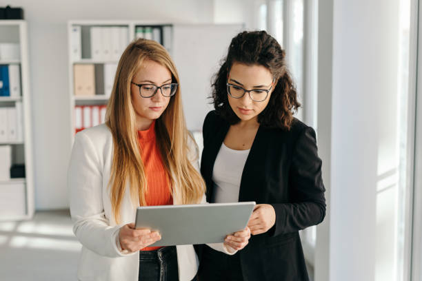 istock Two worried businesswomen looking at a tablet 1224626458