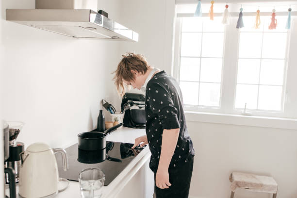 istock Teen cooking on induction cooktop 1224626802