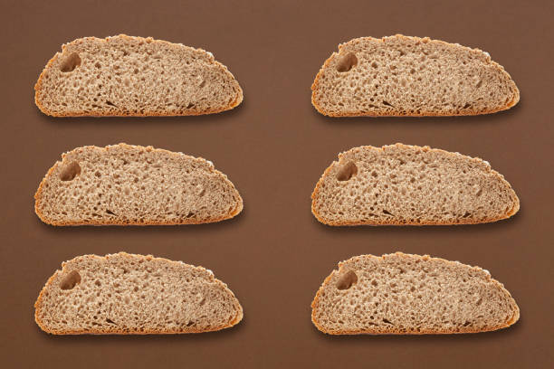 Sliced bread toast made of whole wheat flour photographed on brown background
