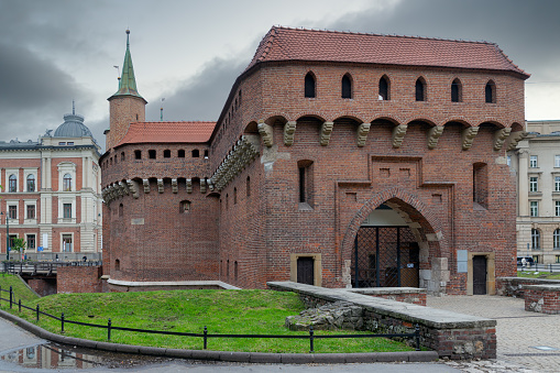 Krakow, Poland - May 13, 2019: Kracow barbican, medieval fortifcation and gateway leading into the old Town of Krakow, Poland