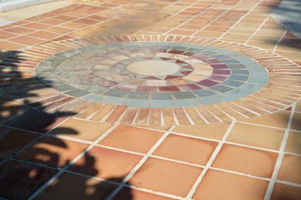 istock Outdoor mosaic, round tiled pattern on the garden floor 1224629497