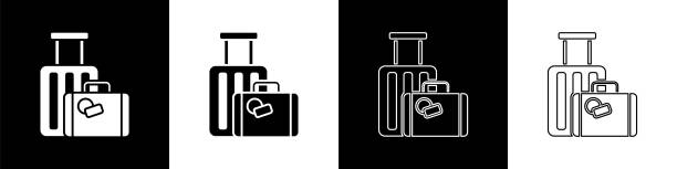 ilustraciones, imágenes clip art, dibujos animados e iconos de stock de establezca el icono de viaje aislado sobre fondo blanco y negro. señal de equipaje de viaje. icono de equipaje de viaje. ilustración vectorial - luggage