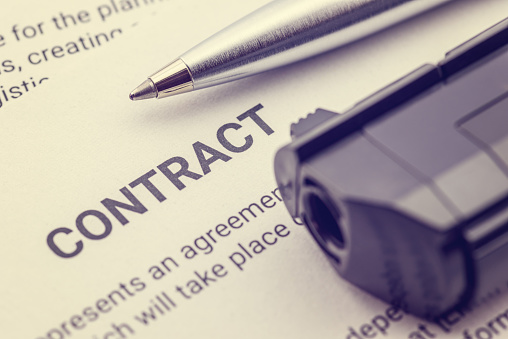 Depicting a contract was signed by a coerced or forced person at gunpoint.
