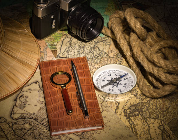 planowanie podróży wakacyjnych z mapą, kompasem - passport map compass old zdjęcia i obrazy z banku zdjęć