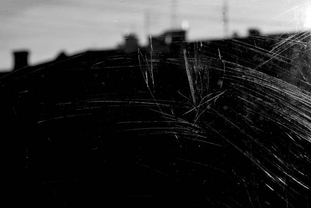 istock White scratches and dust on black background. Old dirty glass. 1224636464