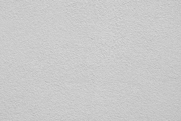 istock Plaster on a white wall. Concrete wall texture close up. 1224636494