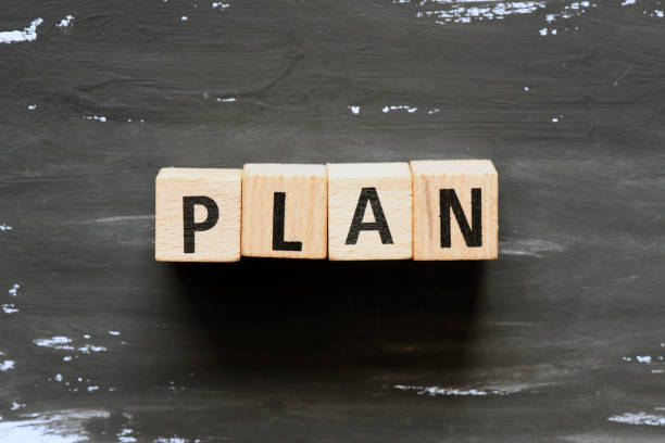 istock Plan word on wooden blocks and black background. Concept in business. 1224636582