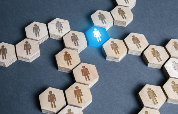 istock Blue human figurine connects employees into a large company network connection system. Leader and leadership. Teamwork cooperation, collaboration. Link of the whole. Important unit, responsible post. 1224637576