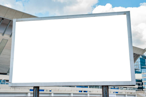 istock Advertising billboard mockup in front of modern office buildings 1224638841