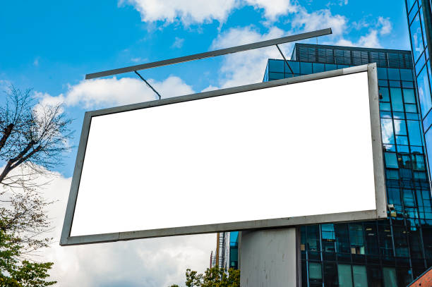 istock Advertising billboard mockup in front of modern office buildings 1224638893