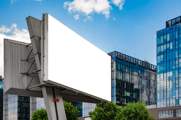 istock Advertising billboard mockup in front of modern office buildings 1224638989