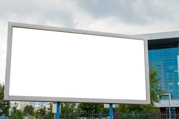 istock Advertising billboard mockup in front of modern office buildings 1224638997