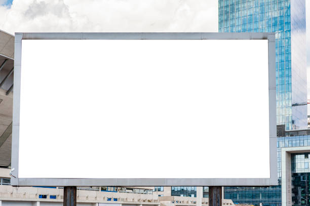 istock Advertising billboard mockup in front of modern office buildings 1224639282